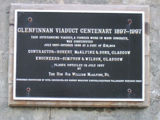 Photo of Glenfinnan viaduct, plaque on an arch celebrating the viaduct's centenary.